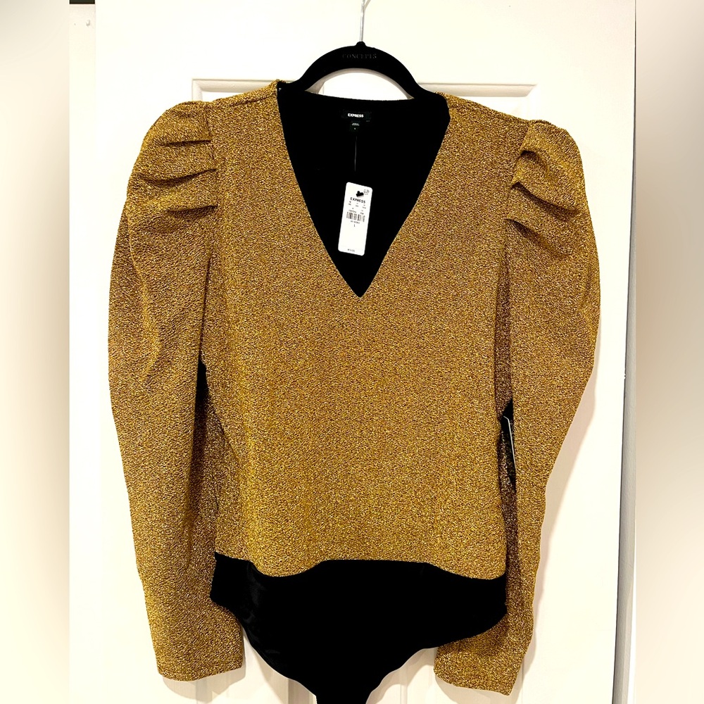 Express bodysuit. Gold, shiny material. Never worn. Tags still on.